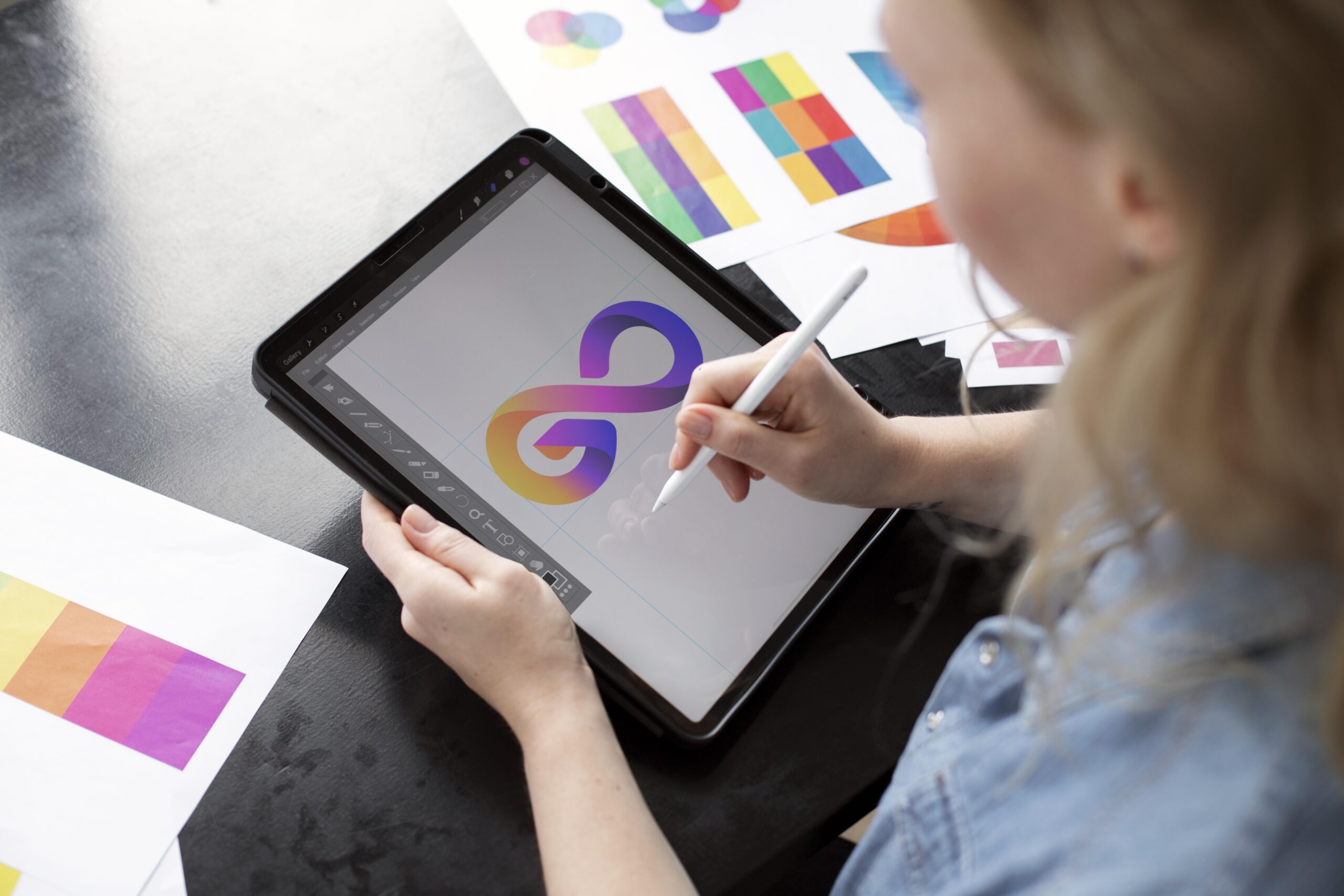 young-female-logo-designer-working-graphic-tablet